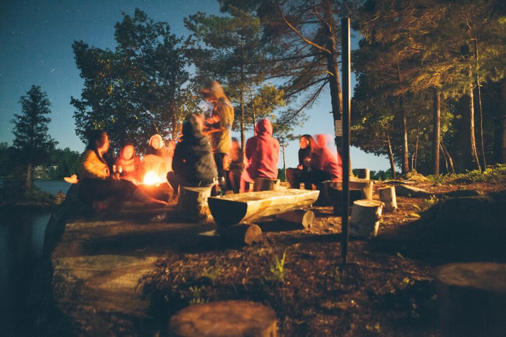 Where Can I Meet People? Top Places to Make New Friends 34 where can I meet people at a group of people near bonfire near trees during nighttime